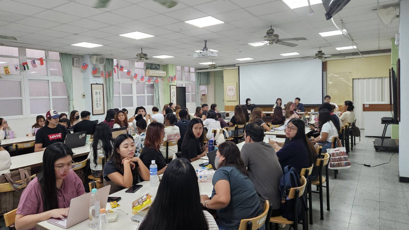 Small-group discussions fill the hall