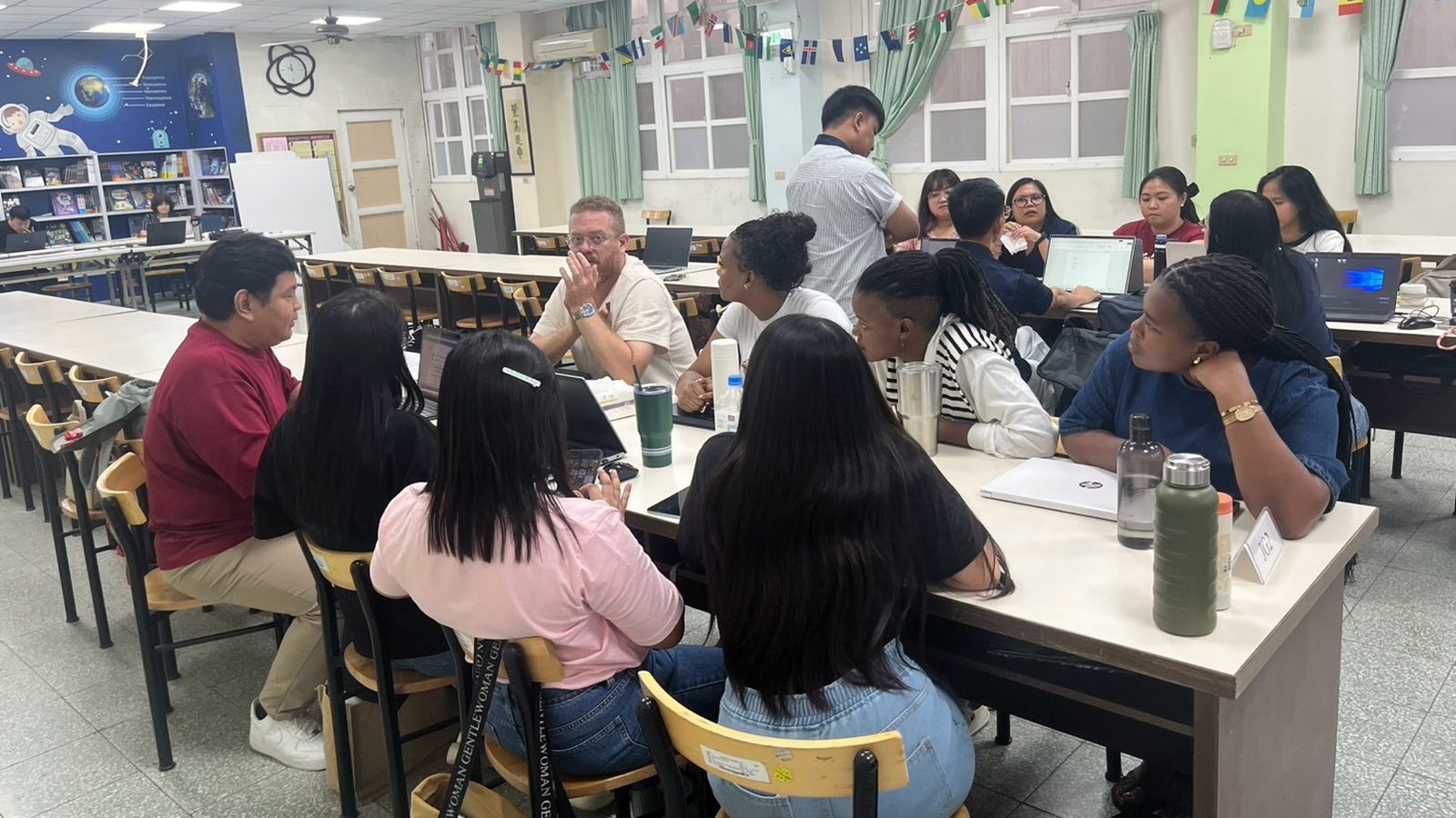 Teachers from different schools work through a topic together