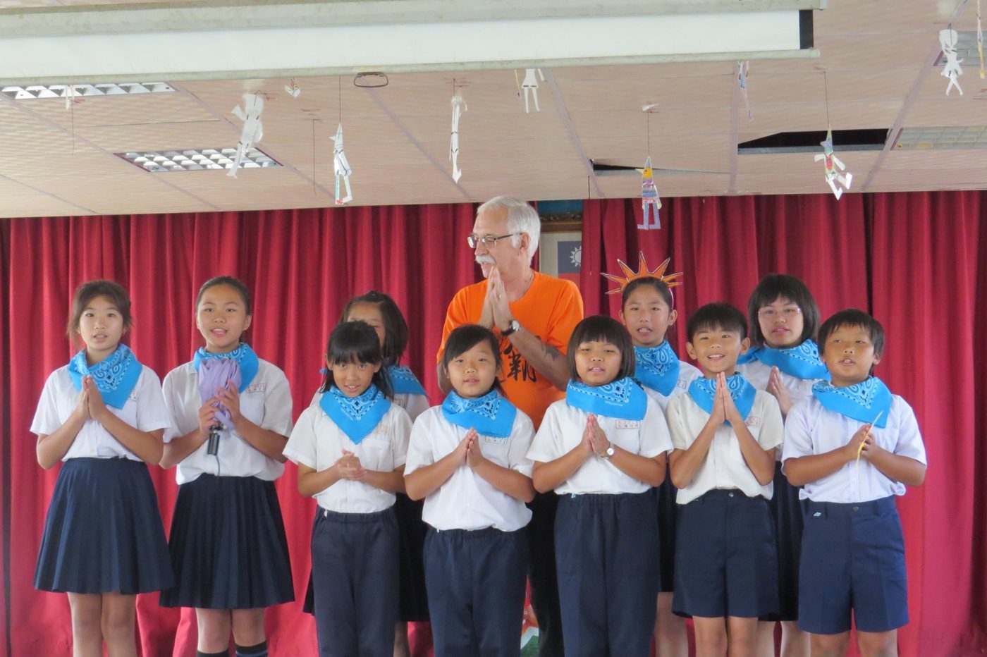 A class stands and sings