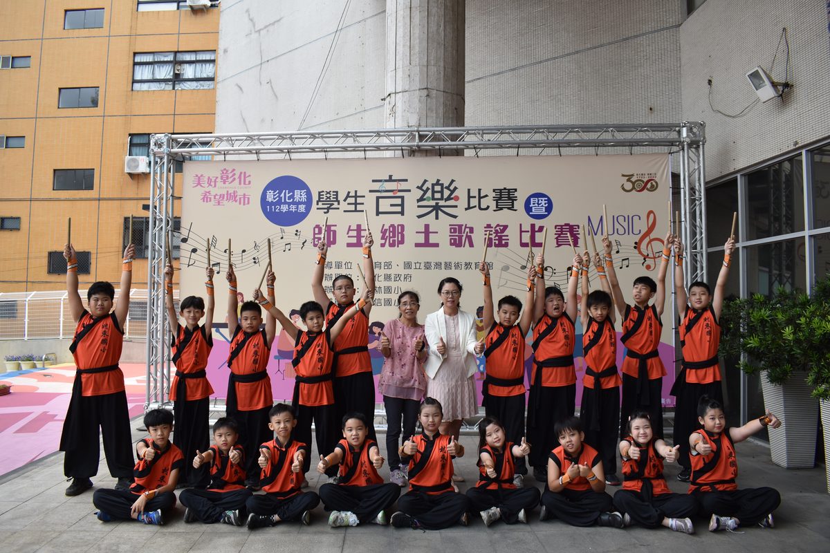 Cundong Ten Drum team group photo with their teacher