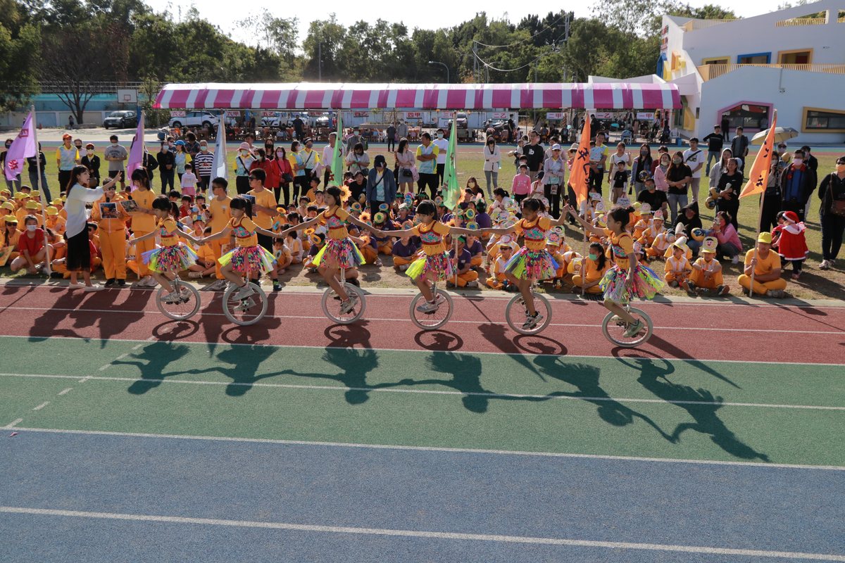Cundong students practicing unicycle on the track