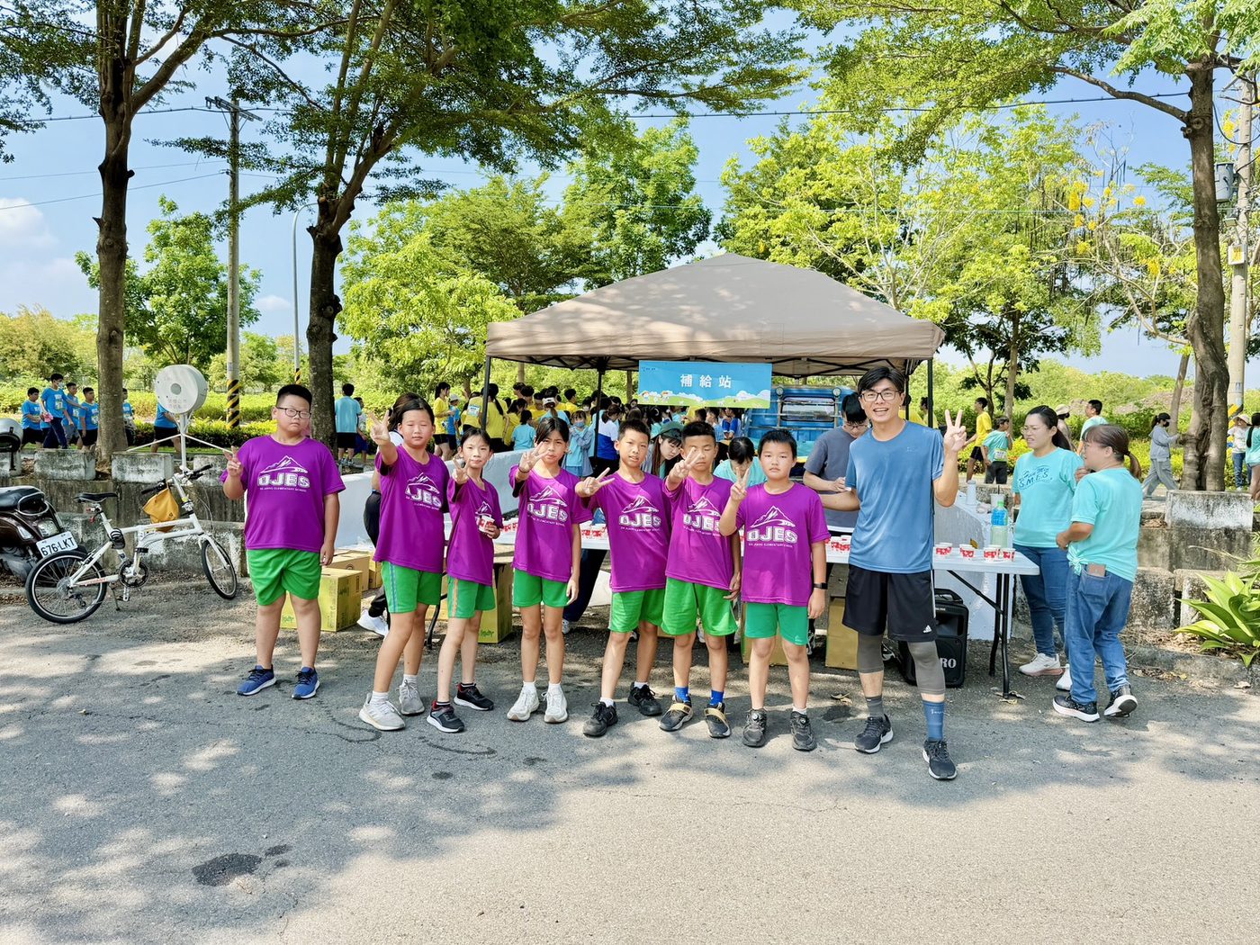 Students running on the road during the graduation triathlon.