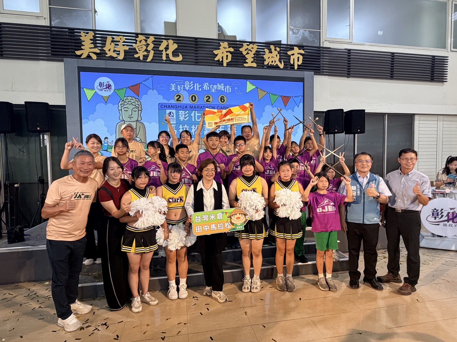 The drumming kids posing with the County Commissioner.