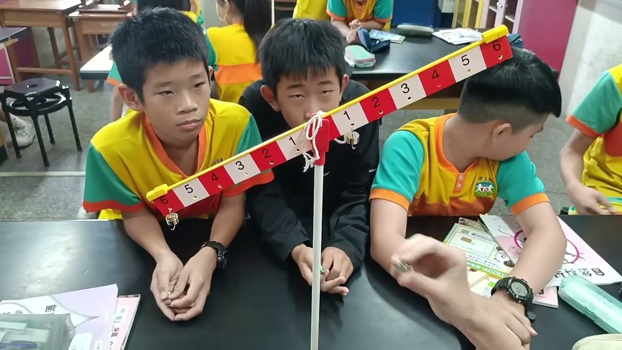 Students experiment with a lever