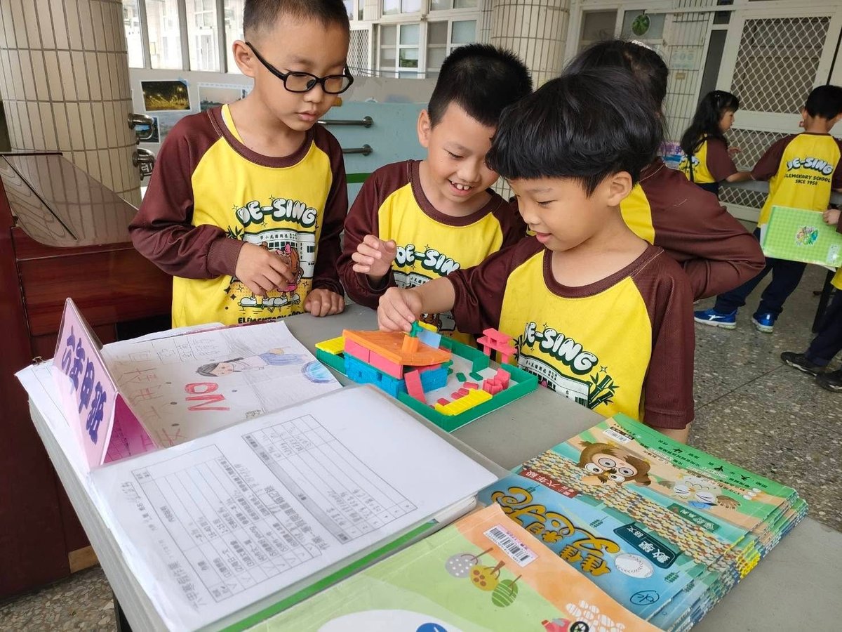 Desing students presenting at a school learning fair