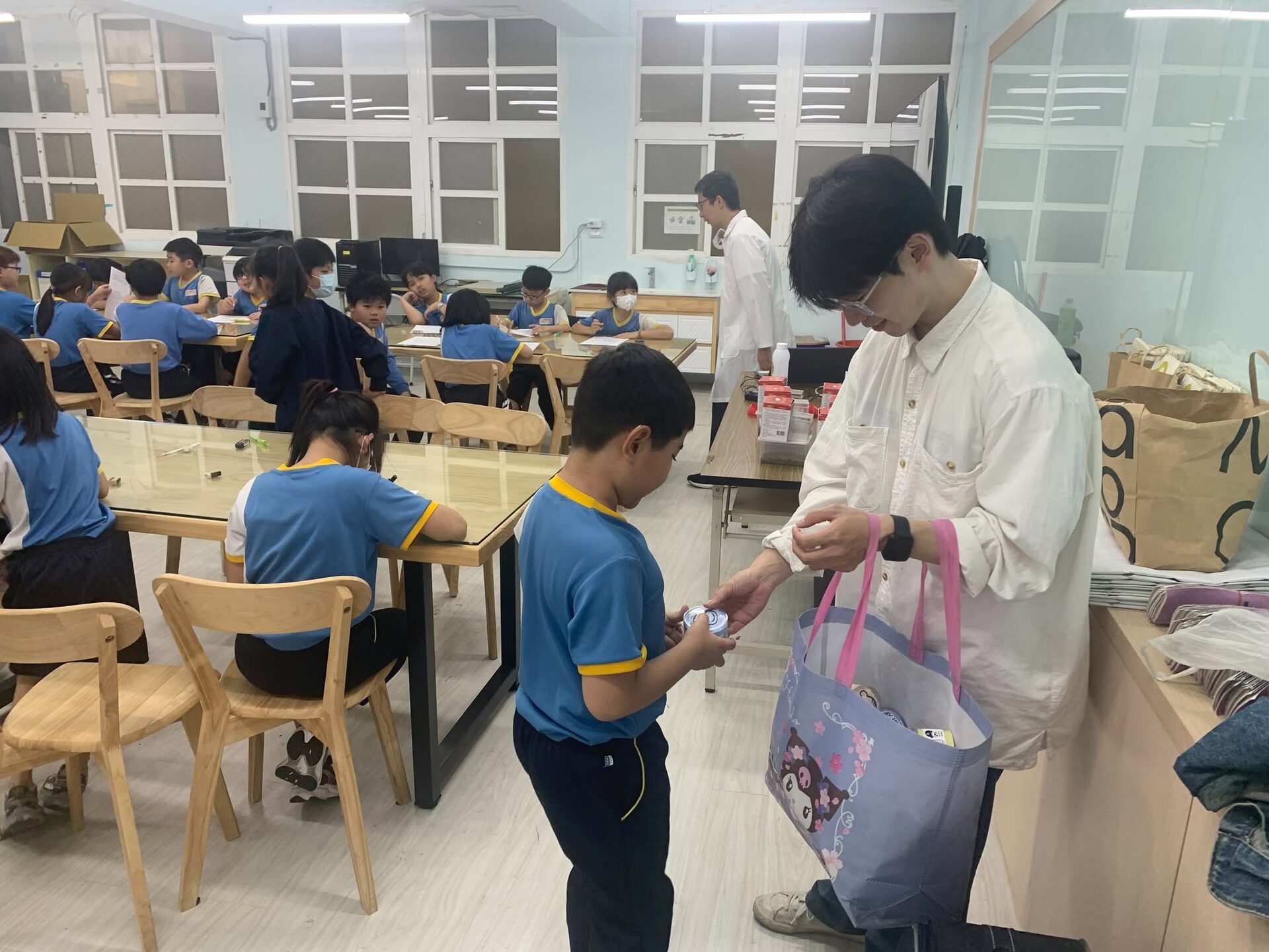 Students receiving small gifts after the event
