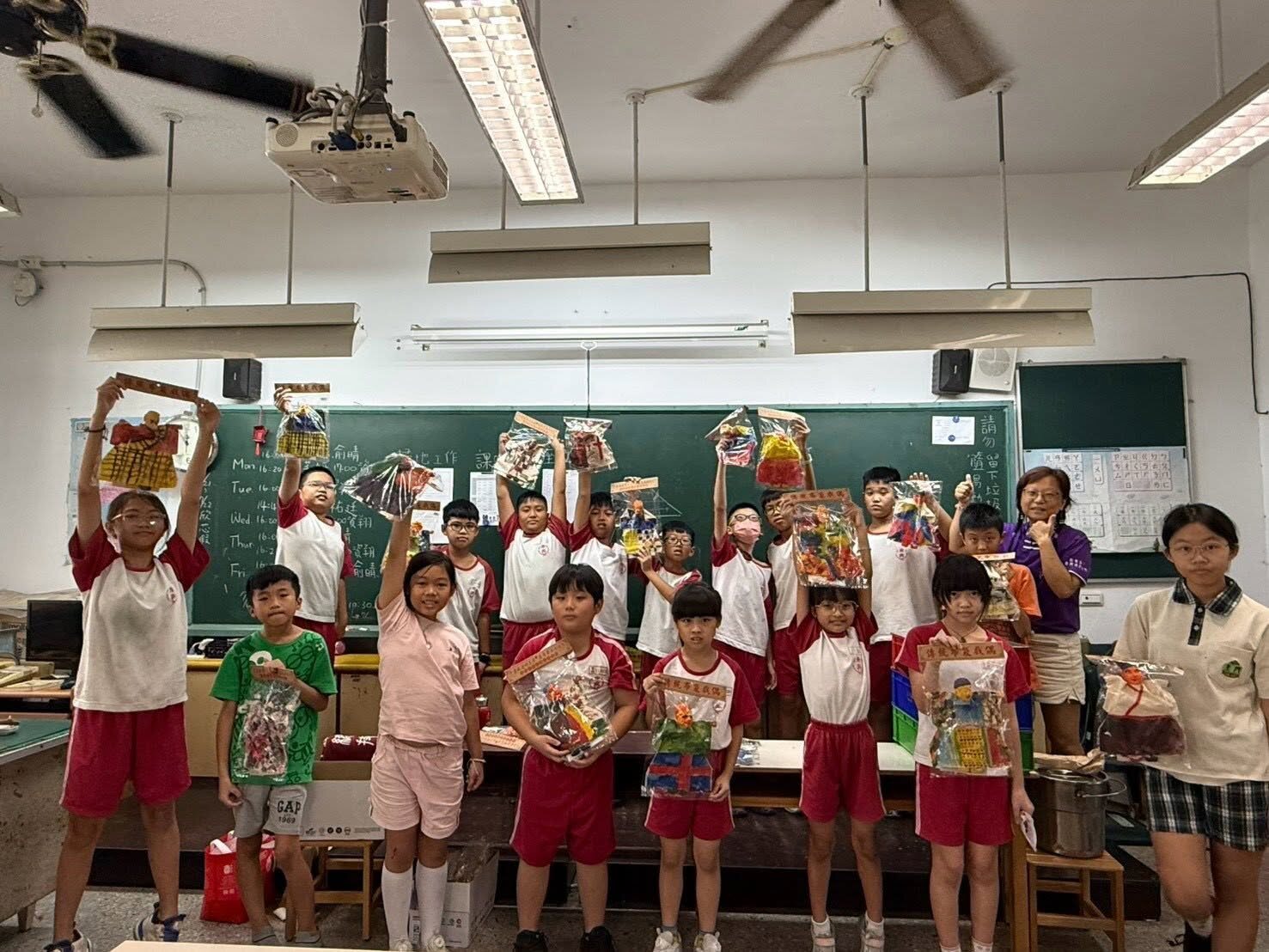 Dongshing students showing off their handmade fragrant glove puppets