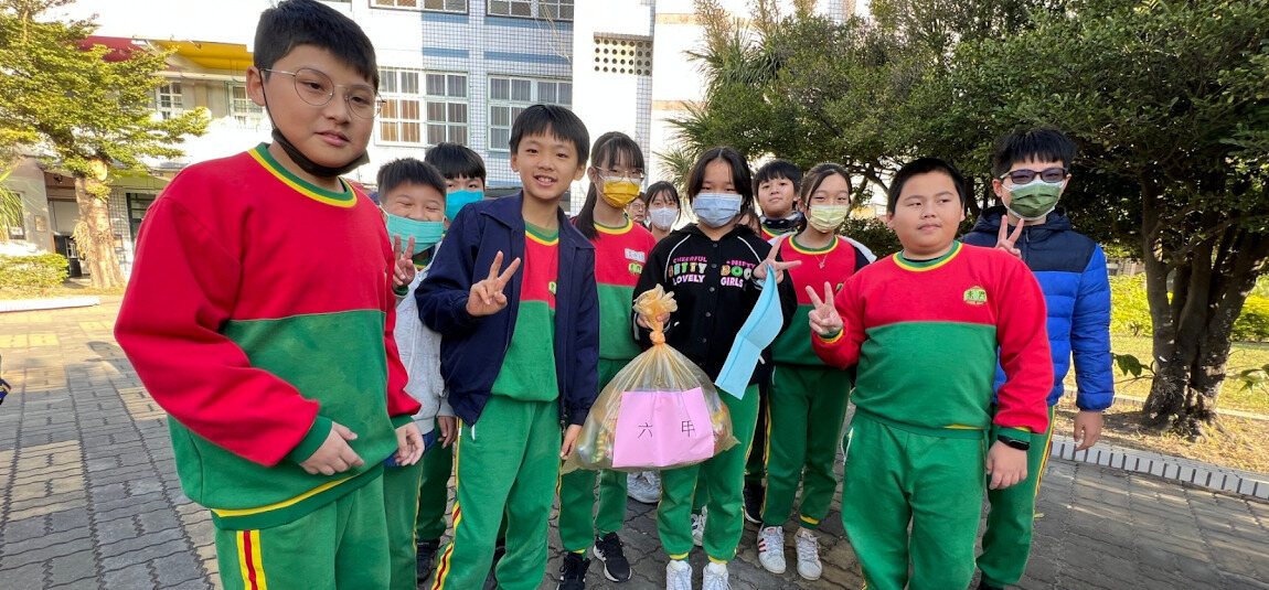 Students gathered together celebrating with treat bags