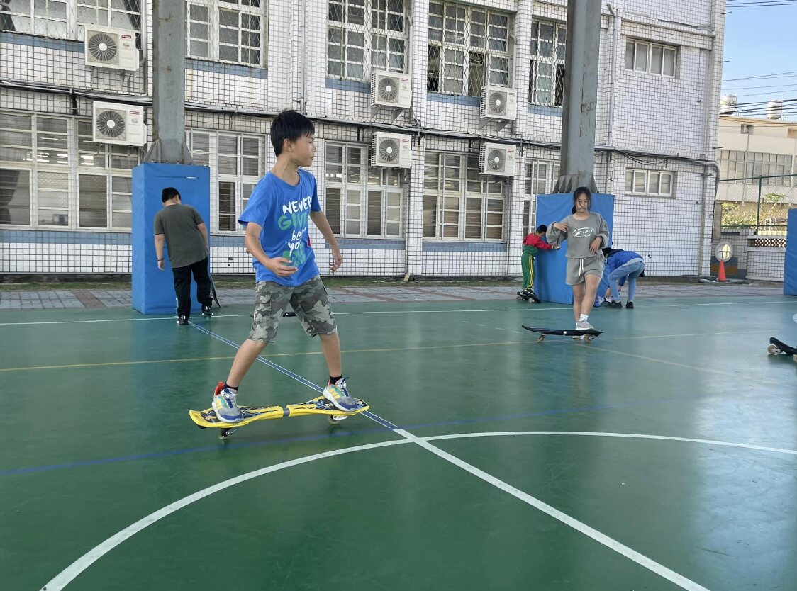 A Dongshing student riding a waveboard