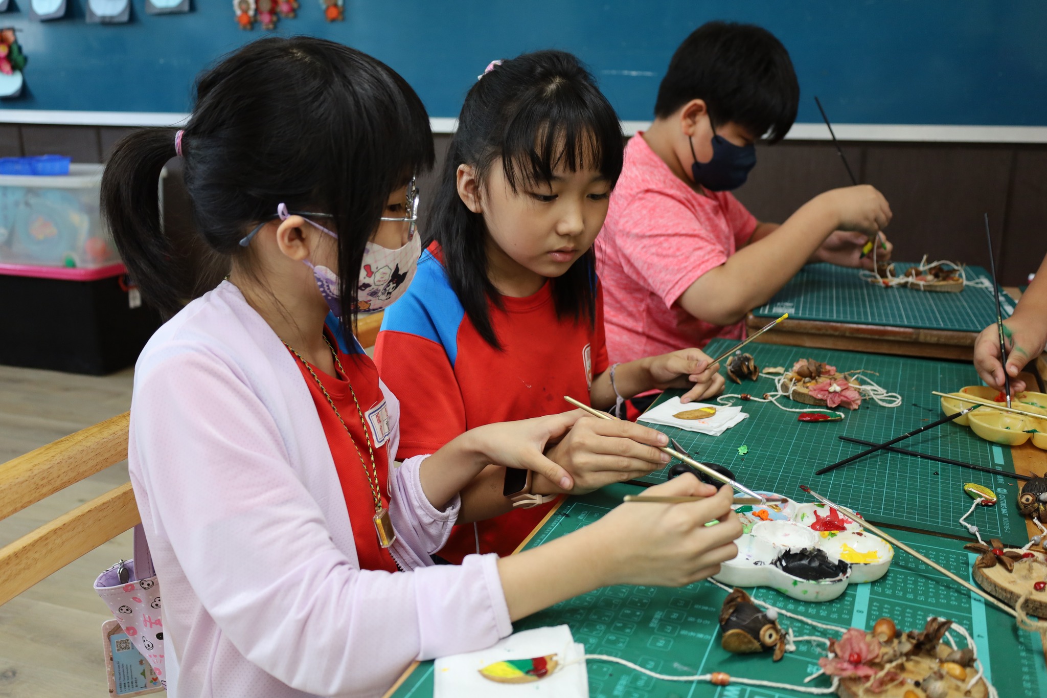 Students doing seed art activity