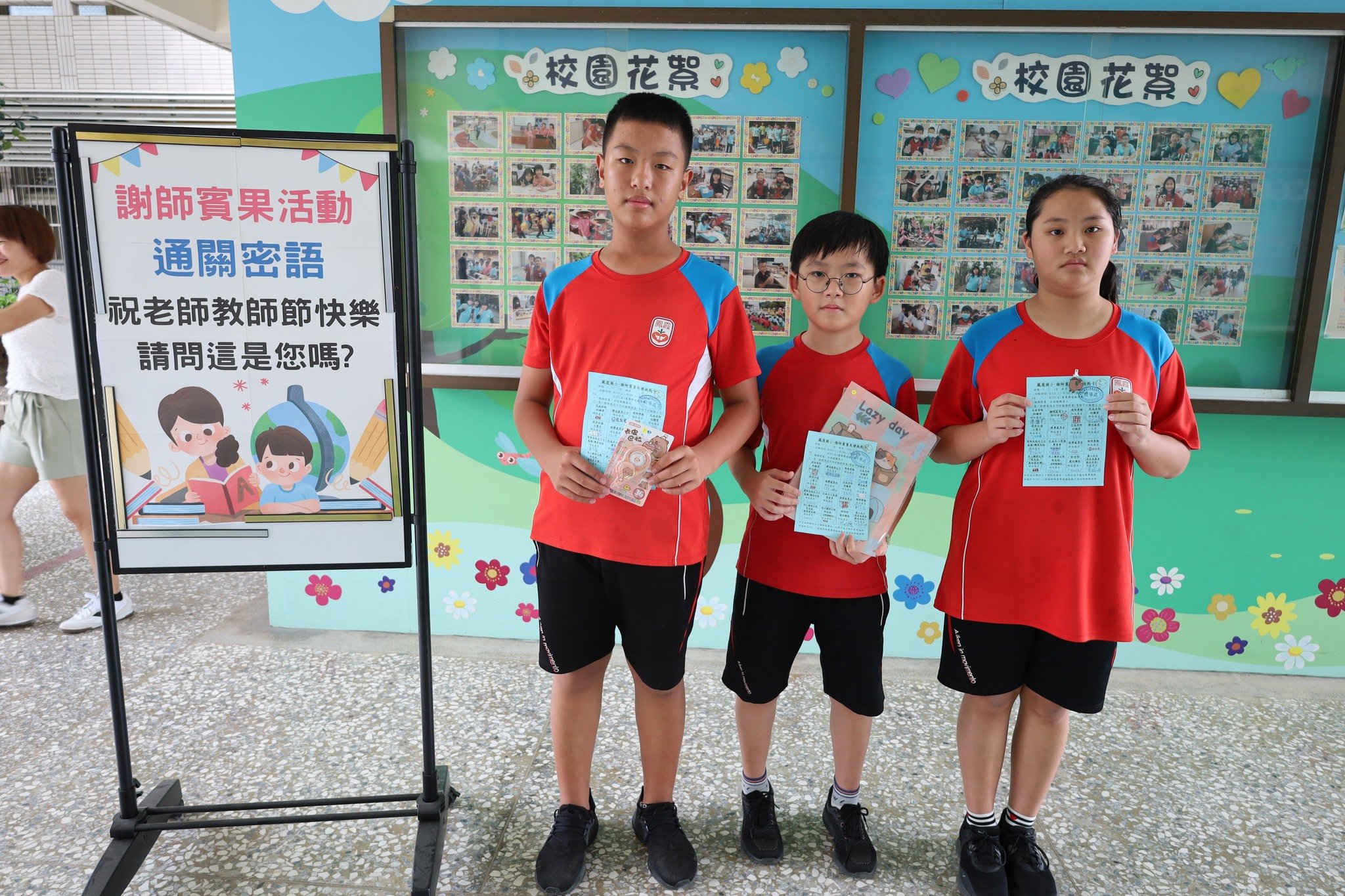 Students with Teacher's Day bingo mission cards