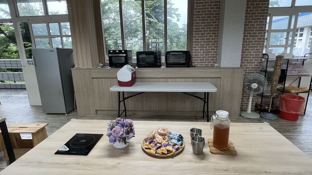 Food Lab countertop with ovens, a cooler, and a nearby refrigerator