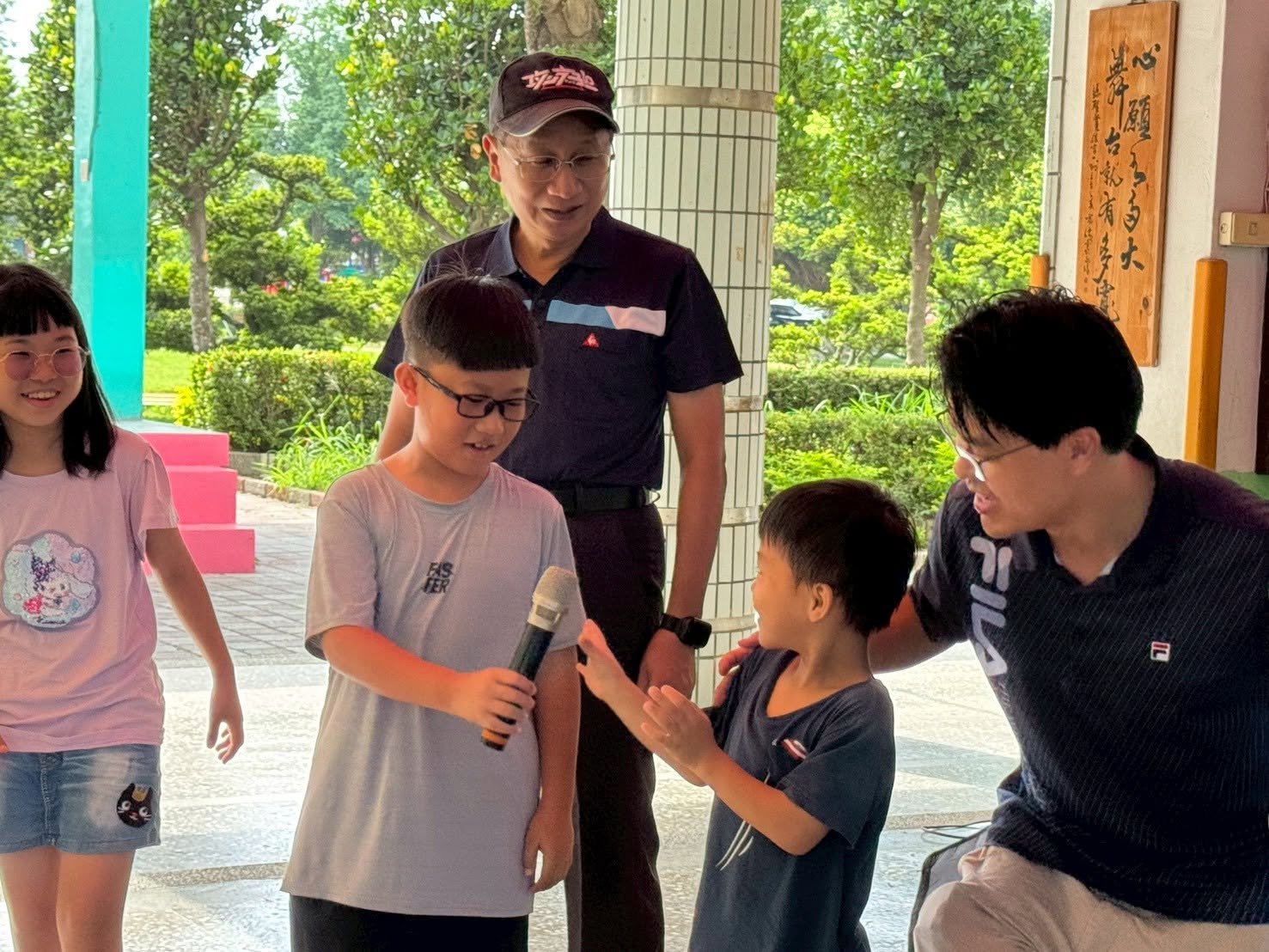 Fuchao Elementary principal talking with students during the birthday celebration