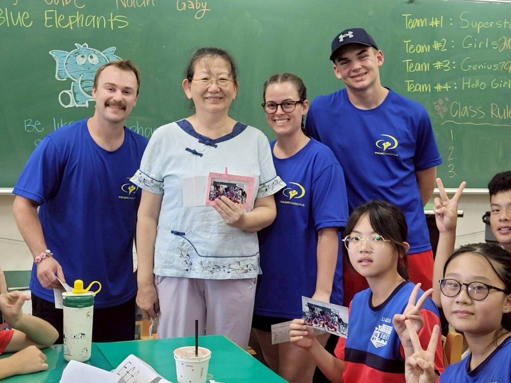 The Blue Elephants team posing with foreign teachers and a Fusing teacher