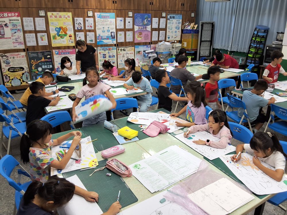 Children showing their artwork