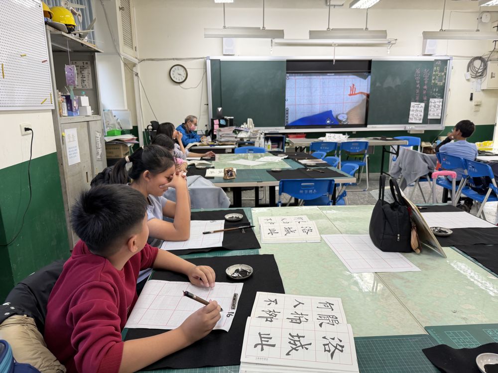 A student practising brush strokes