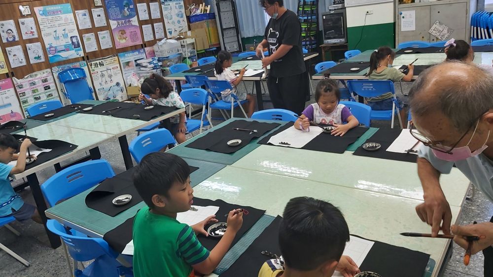 Close focus on writing Chinese characters with a brush