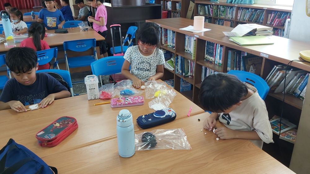 Collage club working at tables