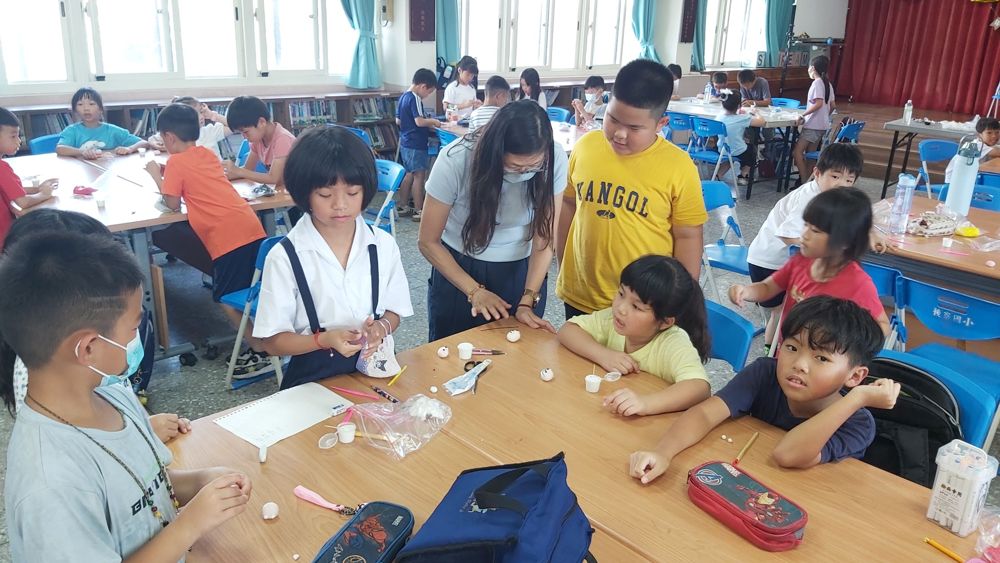 Children making collage pictures together