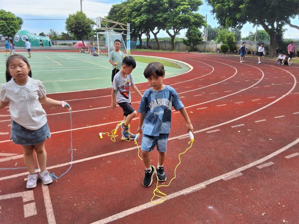 Children jumping rope together