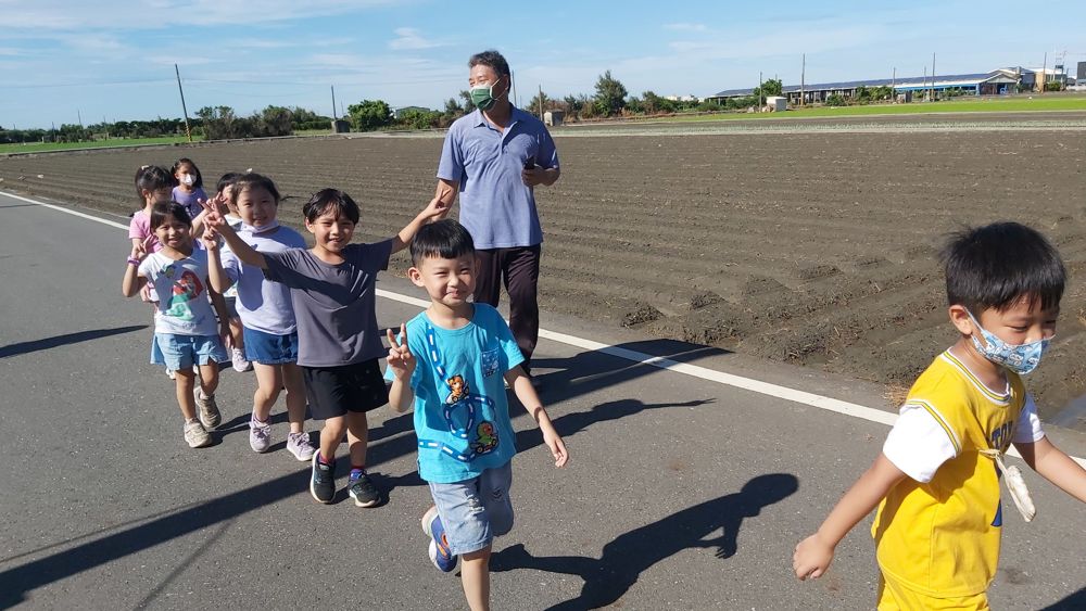 Children running side by side at morning run