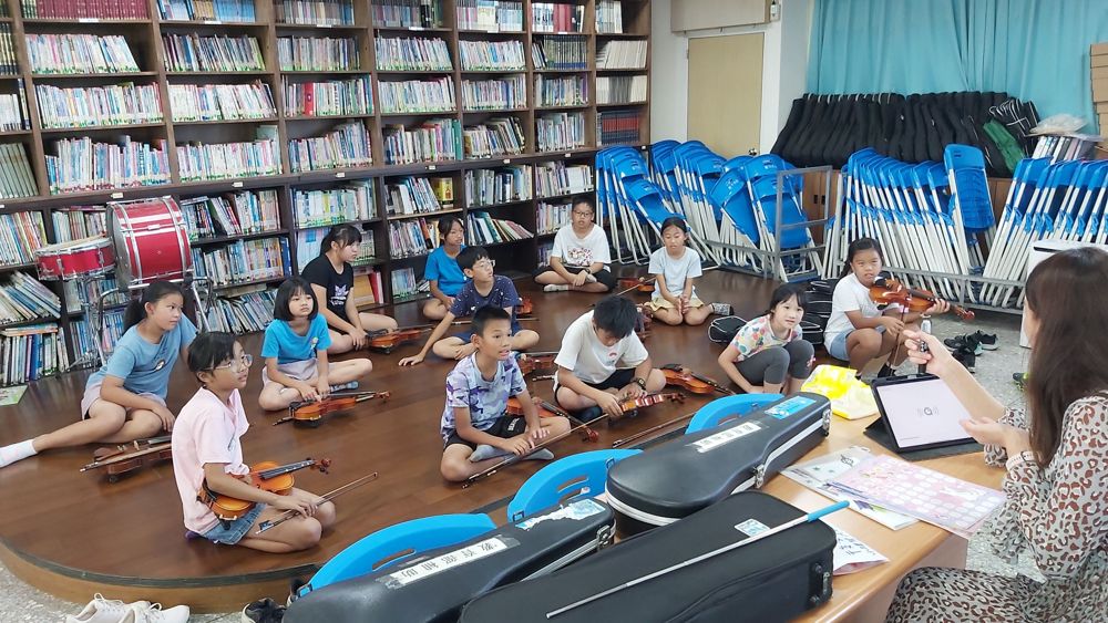 Advanced violin class practising a piece