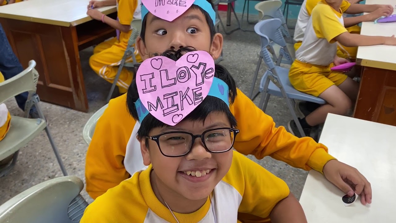 Grandpa Mike with the children of Jhonghe Elementary during his 2019 visit