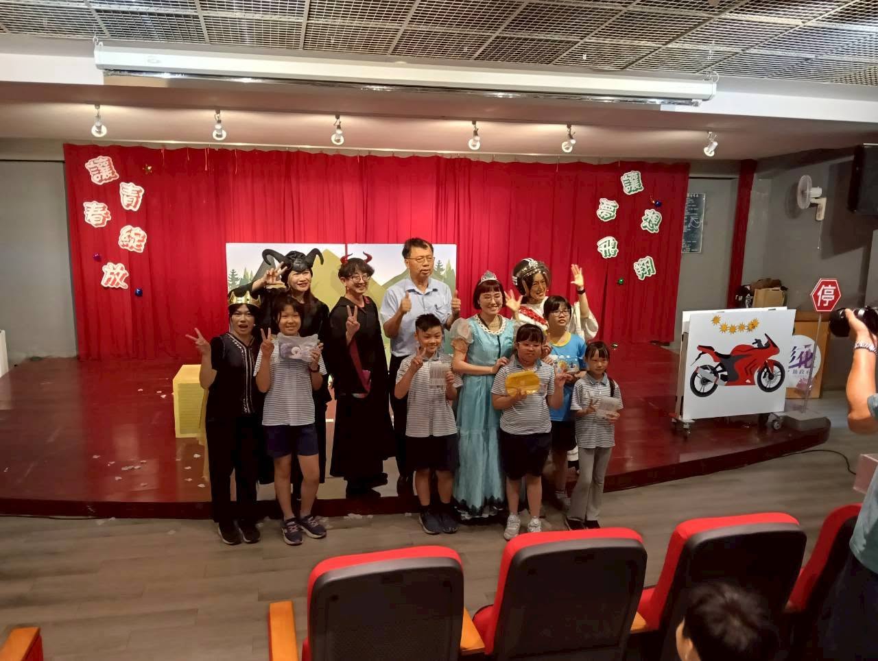 Full audience view of the theater performance at Jioushe Elementary