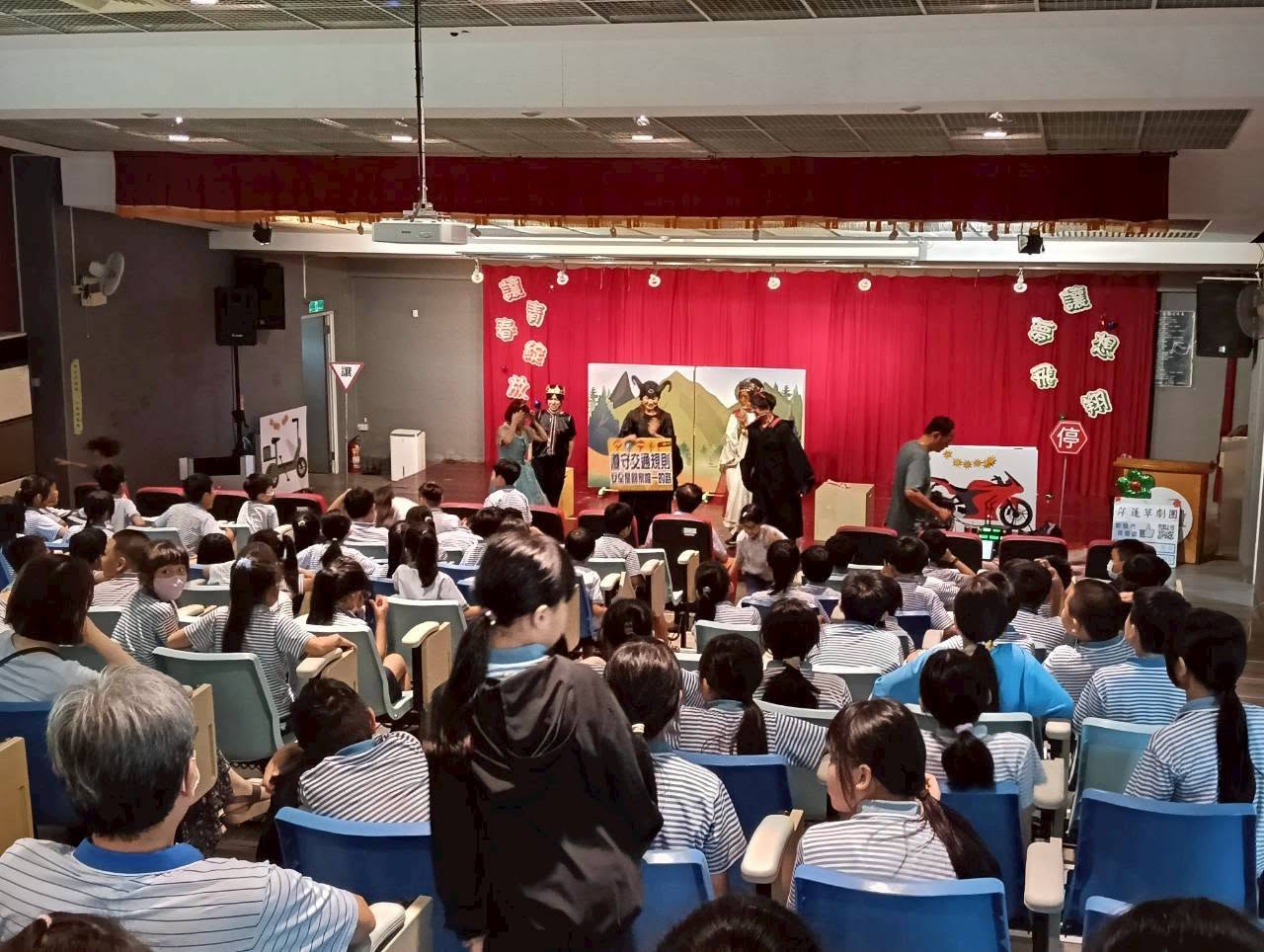 Students watching the theater performance with full attention