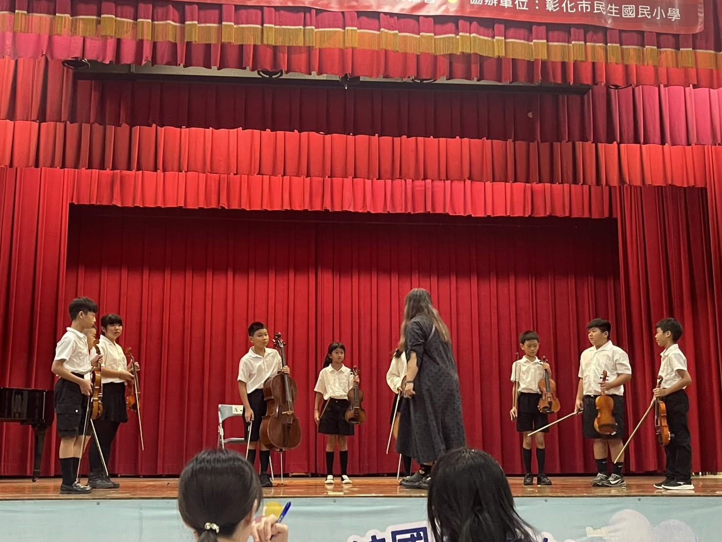 Loojing Elementary's string ensemble performing on stage