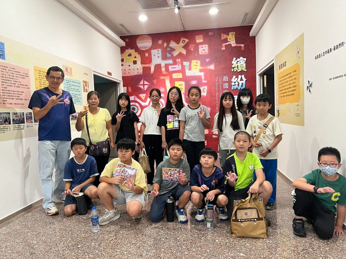 Students posing at the art museum entrance
