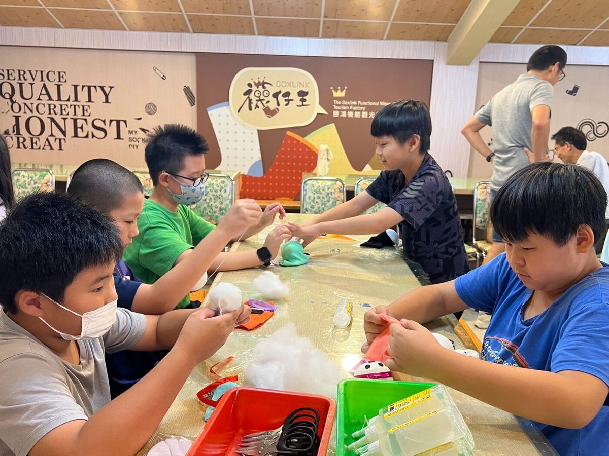 Students decorating their sock-doll craft