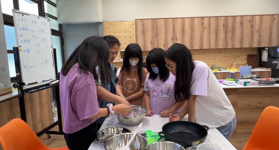 Students making a traditional snack