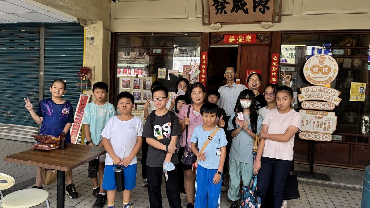 Students posing on the old street