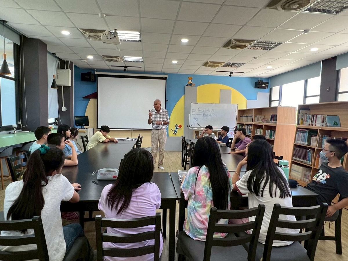 Students listening in the library
