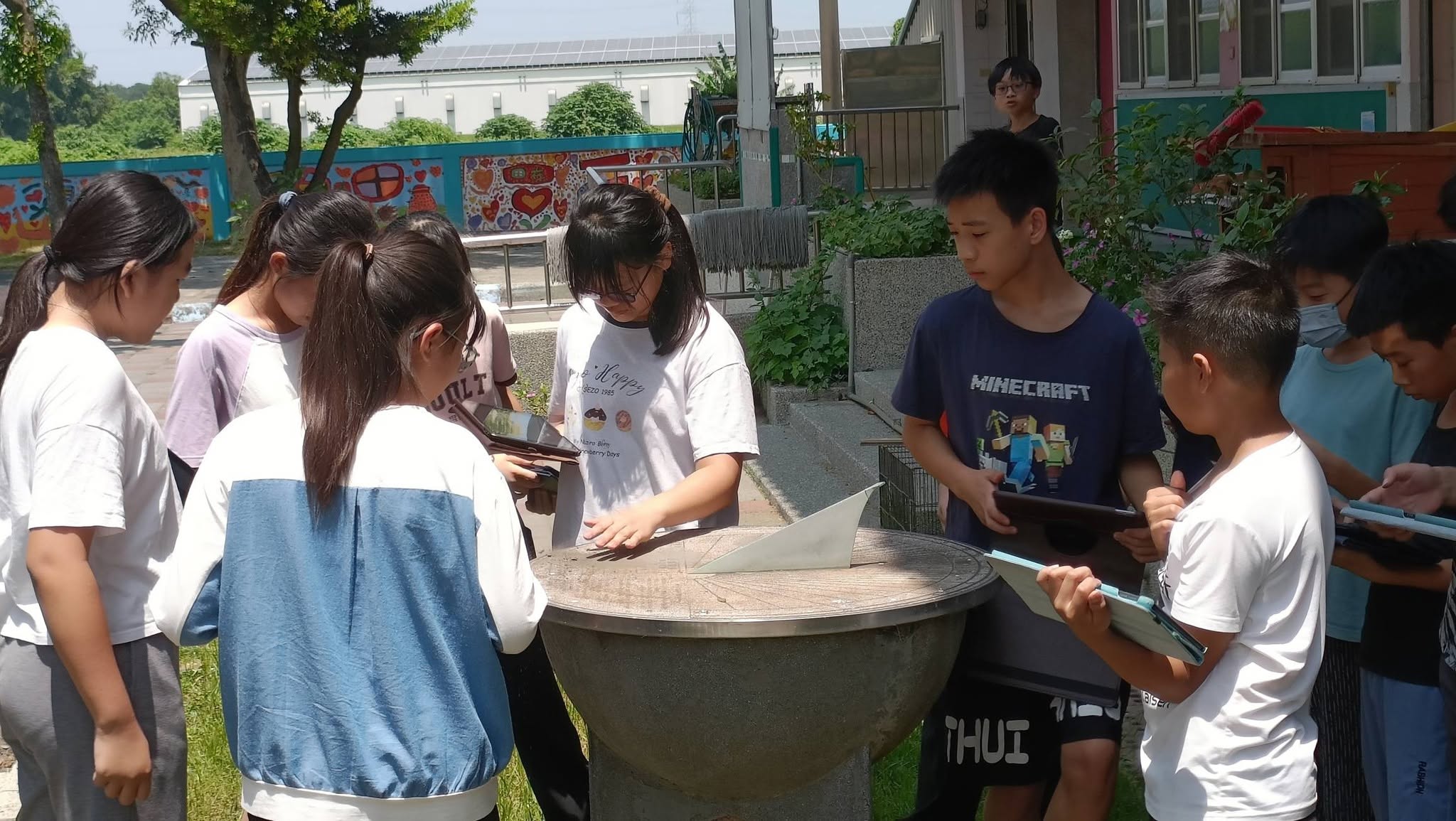 Students solving clues in Tiantou campus mystery game