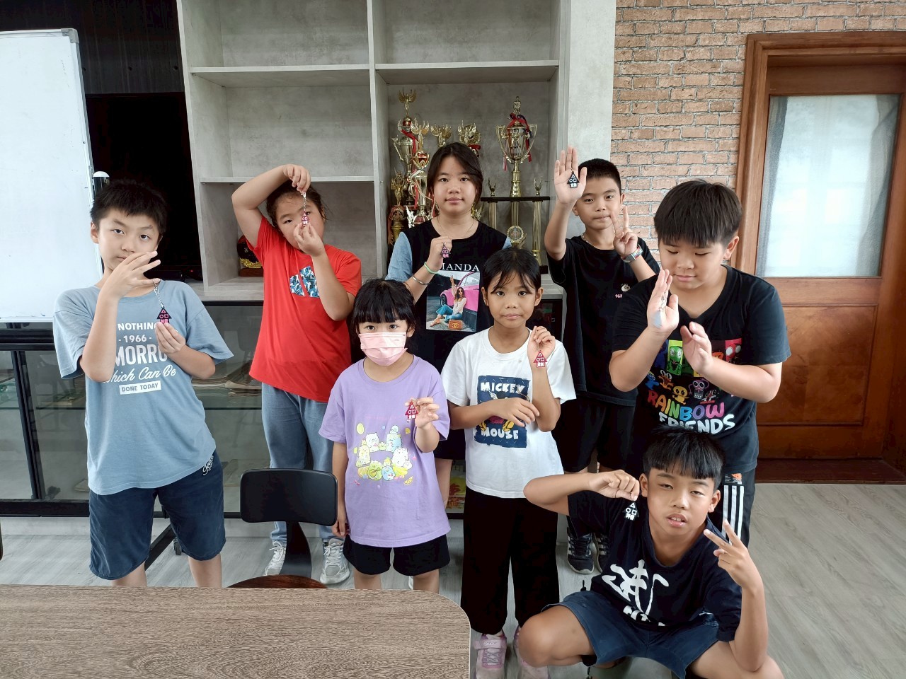 Group of students holding their 3D-printed creations