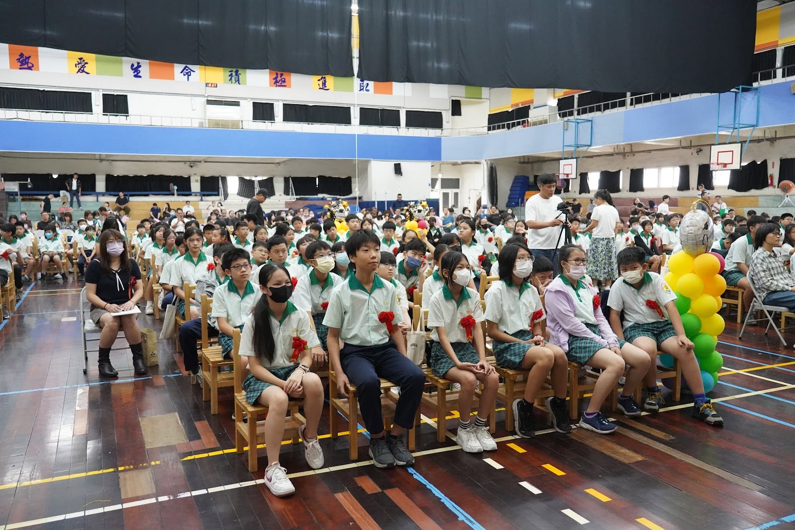 Graduating sixth-graders seated together at the ceremony