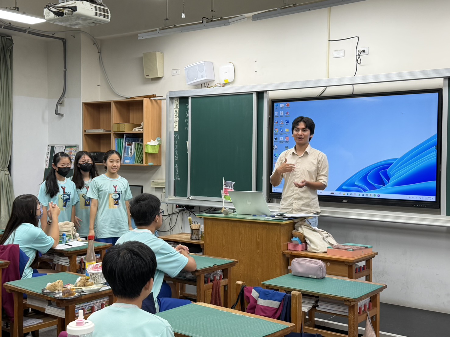 Students presenting in David's English class at Yangming