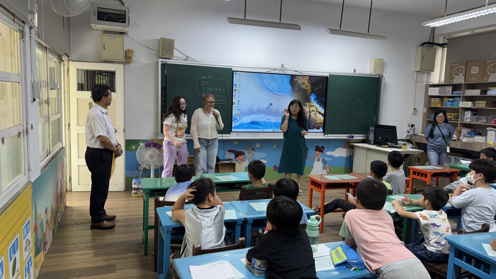 One of the NMU teachers teaching at the front of a Yangming classroom