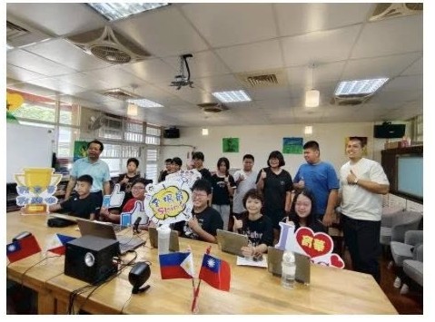 Yuhua Elementary's sixth-grade class gathered around laptops with Taiwan and Philippine flags after a video call with their sister school St. Mary's College of Tagum